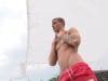 Goodlooking-ripped-young-stud-Maori-Mortensen-strips-red-shorts-stroking-huge-uncut-cock-006-gay-porn-pics
